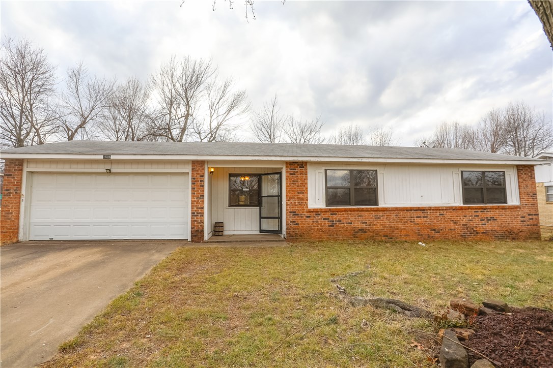 Subject to Probate Approval. This 1974 1-Story, 3-Bedroom, 1.5-Bath, brick and frame sided home with 2-car attached garage situated on good sized fenced yard with a covered front porch. Smaller in size, this home is located on a busy road with easy access to Elm Springs Rd near I-49, this home could be a good starter or investment opportunity as a rental as a fixer upper. Eat-in kitchen with cabinets, some counter-top space and no range, laundry area in garage, storage shed conveys and covered back patio.