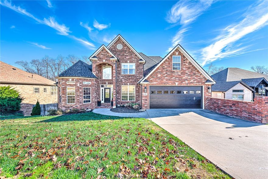 Exquisite family retreat in the heart of Bentonville offering 5 bedrooms, 4.5 bathrooms and 4,432 square feet across 3 thoughtfully designed levels. Features include a chef’s kitchen with custom wood cabinetry, oversized pantry and beverage cooler, a spacious primary suite on main level with deck access overlooking the wooded outdoor oasis, bonus craft room, stunning office, weight room and a walkout basement with a kitchenette that can serve as an entertainment area or guest suite. The backyard provides a large heated pool and waterfall hot tub, wood-burning fireplace and covered dining space for exceptional outdoor living. The location is unmatched at less than half a mile to I-49, one mile to the new Walmart Home Office, within 3 miles to Downtown Bentonville, Crystal Bridges, parks, biking trails and top-rated Bentonville schools. May 2024 NEW Roof, Gutters, Garage Door and AC Unit. This move in ready home combines convenience, space, and luxury in one of the most desirable areas of Northwest Arkansas.