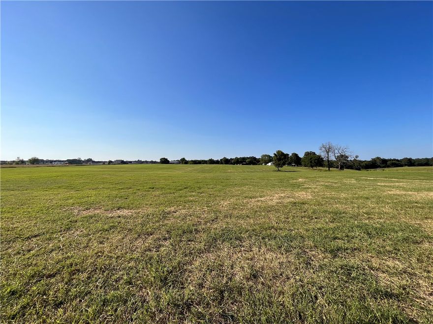 Great development opportunity near new amenities in desirable Elm Springs area. Centrally located in Northwest Arkansas! Buildable open acreage near new park with trails, splash pad, tennis courts, and multiple playgrounds and fishing lakes. Easy access to Springdale Bypass 612, 112, and 56th street. Less than 5 minutes to Elm Springs Rd amenities such as groceries, gas, restaurants and more. Water at street. Buyers due diligence to confirm location of all utilities.