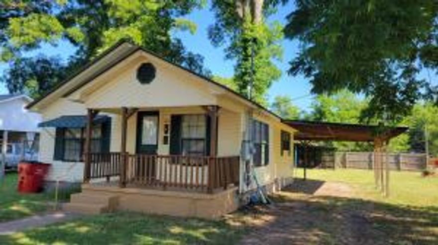 Corner lot cutie...3-bedroom 1 bath with nice size backyard. This home has recently had interior painted and offers new flooring. Maintenace free exterior, carport and outbuilding. AC is only 2 years old. Metal roof and all electric.