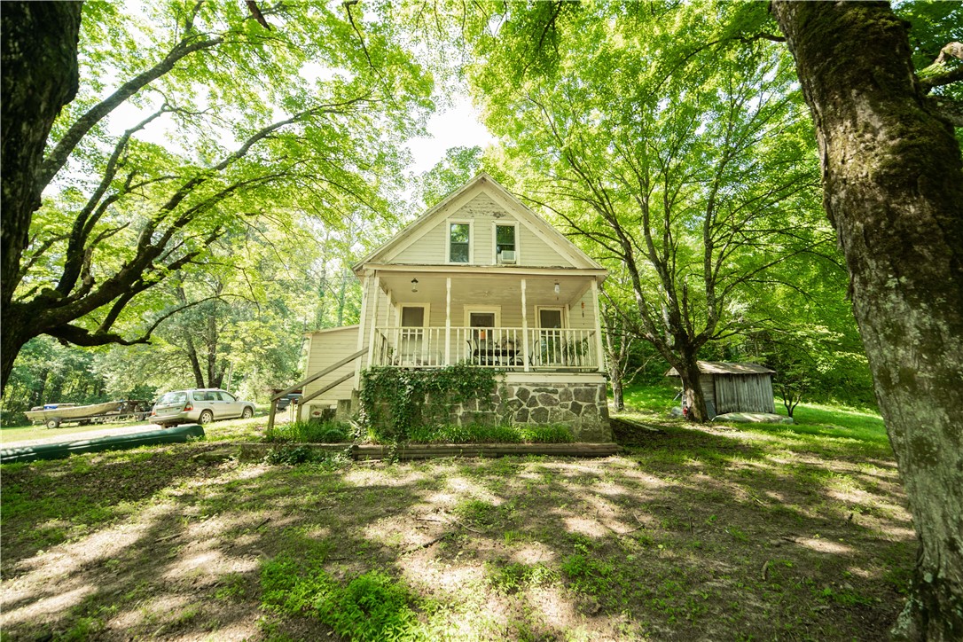 Historical home on 15 beautiful acres filled with wildlife. Natural spring in front of the home, spring-fed pond, and bluffs/springs on the West side of the property. 4.5 miles from a Dollar General, 14 miles to the Mulberry, 1.5 miles from the White River. Original hardwood floors, the roof is less than 10 years old, and the foundation has recently been redone! The plumbing lines are 5 years old, and plumbing has been stubbed out on the 2nd floor to make a true master. Bonus room on 2nd floor, with a half-finished bedroom. Could be a true master suite once completed. Plenty of wildlife, spring in front of the house, a spring-fed pond, and bluffs/springs on the West of the property. 4.5 miles from a Dollar General, 14 miles to the Mulberry, 1.5 miles from the White River. 10 acres of the land are also listed separately under MLS 1189086.