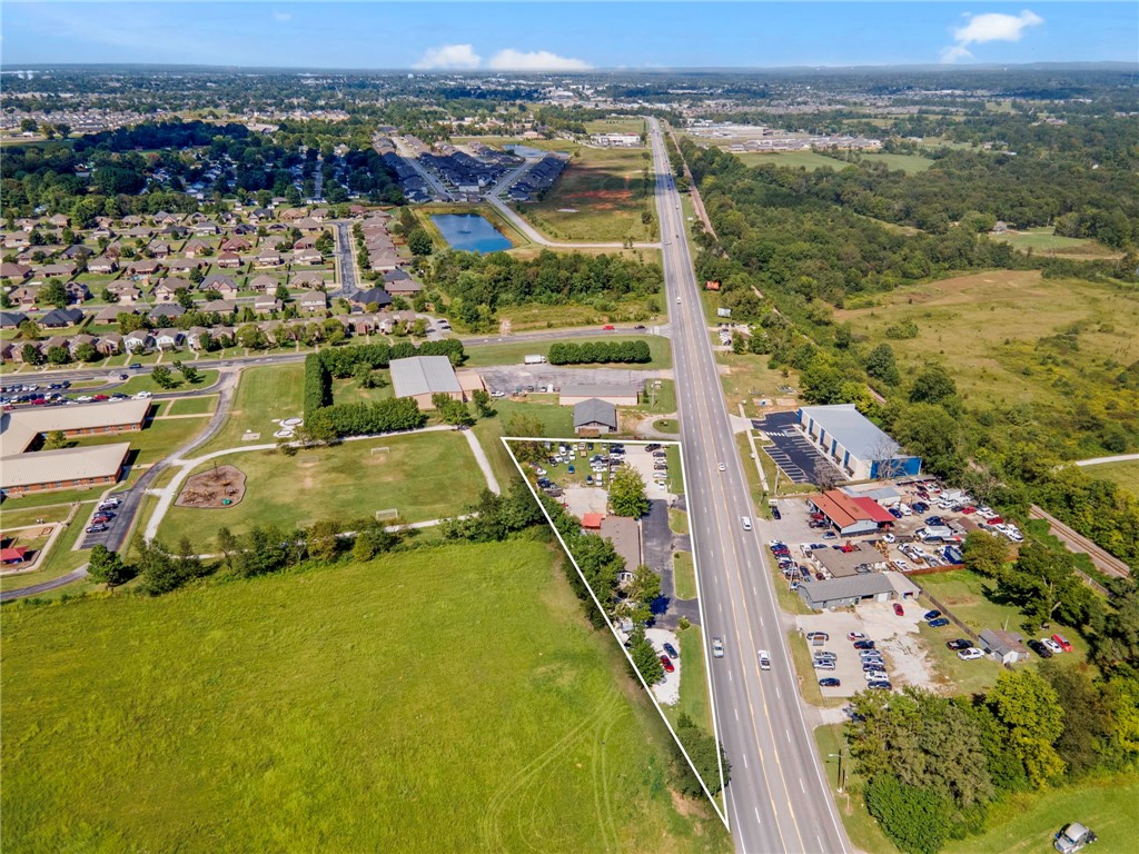 Prime C-2 Commercial Property on Hwy 71B! Offering 27,000+ vehicles daily, this property provides unmatched visibility and exposure in one of Lowell’s most active corridors. Just minutes from I-49, it sits at the center of rapid residential and commercial growth, surrounded by thriving businesses and strong demographics. With excellent frontage, easy access, and a highly desirable zoning designation, this site is perfectly positioned for retail, office, or service-based businesses looking to expand and succeed in Northwest Arkansas.