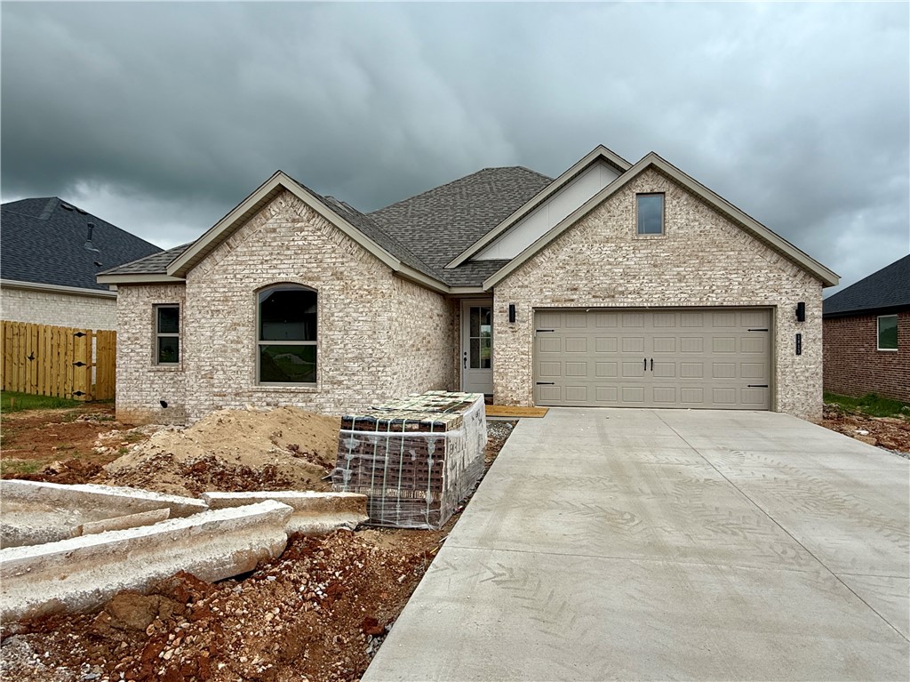 Pea Ridge welcomes you to its rapidly growing community. The Yorktown subdivision places you at the heart of it all, offering close proximity to schools, parks, and beautiful scenic views. The Mallard plan greets you with a split floor design, placing all secondary bedrooms at the front and side of the home, while the primary bedroom is nestled in the back for added privacy. LVP flooring runs throughout the main living areas and laundry room, adding a touch of elegance to the open-concept layout. The primary bedroom offers a sense of seclusion yet provides easy access to the kitchen and living room. This plan also features a standout covered back patio, an electric fireplace, 3CM granite countertops throughout, and a gas range.For a limited time rates starting at 4.99% OR $7,500 from builder & up to $4K from preferred lender. For access to see all the homes stop by the model home at 1602 Christman St. Open Monday, Tuesday,Thursday, and Friday from 10-4 and Sunday 1-4.