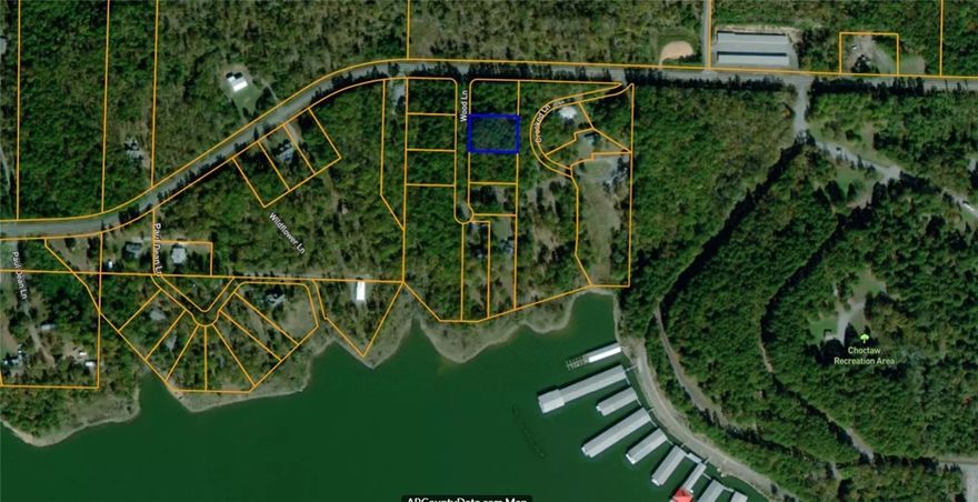 Cleared, leveled, and ready to build! This prime lot near Greers Ferry Lake features a completed perc test, established driveway, utilities at the street, and finished dirt work. Located in Woodland Shores, just minutes from lake access—bring your builder and start right away!