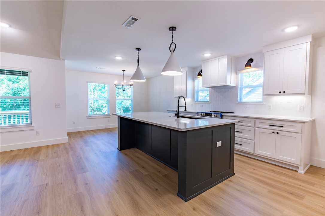 Gorgeous New Construction home on SUPER FLAT LOT in Bella Vista. This home is 2 bedroom, 2.5 bath, with an office. Abundant natural light in the spacious living room. Decorative fireplace framed by built in's
and floating shelves. Gorgeous kitchen with a large island for entertaining. Split floor plan with a large
master suite. Master bathroom with a free standing tub and custom tile shower. Large master walk-in
closet that leads to the laundry room. Half bath close to the entry for guests. Custom cabinetry &
woodwork with a mixture of Quartz and Granite countertops throughout the home. Beautiful modern light
fixtures and cabinet hardware. Smart thermostat for energy efficiency. The exterior has a Ring Doorbell,
custom cedar shutters, covered deck, & attached 3 car garage. Close proximity to Bike/Hiking Trails, Rec
Centers, Golf Courses, and Lakes!!!