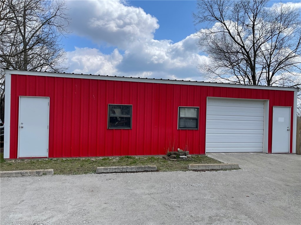 1200 sq ft shop building located along busy highway.