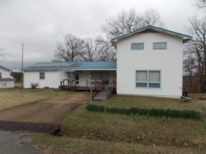 The Perfect Zoom House!Do you work for one of those Fortune 500 companies that are going to allow you to permanently work from home? If so, why not do it from the lake? This 3 BR 1 1/2 BA home has huge bonus spaces that would be the ultimate office complete with fiber internet service PLUS a work shop and garage basement deep enough to hold a small fishing boat. Even though it is only officially 3 BR's there is a large bonus room upstairs that could be a 4th bedroom. The main bath has his and her stools and sinks. You even have a distant view of the lake from the upper deck. Solar panels keep your energy bills down. With 2 large shaded lots has enough room for you to build the shop to hold the rest of your lake toys.