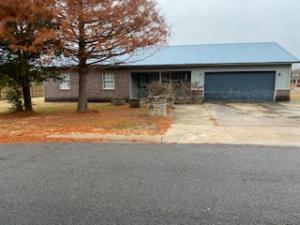 Large 4 bedroom 3 bath home. Combined living and dining area. Garage has been enclosed to make bedroom and storage area. Square footage from Tax Record and does not show enclosed area for bedroom and bath.