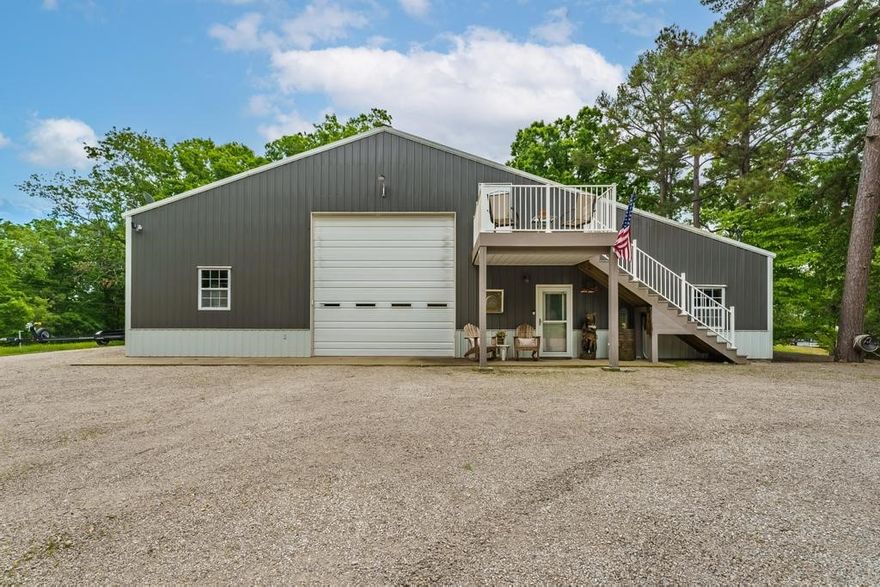 Looking for the perfect, low maintenance, weekend getaway on Beaver Lake with room for all your toys plus friends & family...? Welcome to this beautiful, fully furnished, move-in ready, barndominium with views of Beaver Lake. This metal boathouse is 60'x50' with a 12'x37' add on. The flat cleared lot has ample space for several RV's and boats and Clifty Boat Launch is only 4 miles away. The large garage space has 15' doors on both sides and a power lift to easily store things in the huge loft space. The living space features high end luxury finishes, including a Bosch stove, LG Thin Q fridge, Toto bidet, honed Quartzite countertops and so much more. The living space sleeps up to 8 people comfortably and has two full bathrooms. Property includes a Trane heat pump, central heat and air with an additional mini split in the kitchen, reverse osmosis water system, laundry room, washer, dryer and all furniture pictured.