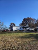 Prime location on Boat Dock Road just 2 miles from Cricket Creek Marina. Beautiful Table Rock Lake views from the front of the flat park-like one acre lot. Watch the fireworks and airshows from Thunder Ridge Amphitheater (located less than 2 miles away as the crow flies to the North). Rapidly growing area with no zoning restrictions. Located across the street from a successful wedding venue and there are multiple resorts under construction in the area. Claim your piece of Boat Dock Road for your private residence, business location or short term rental investment property.