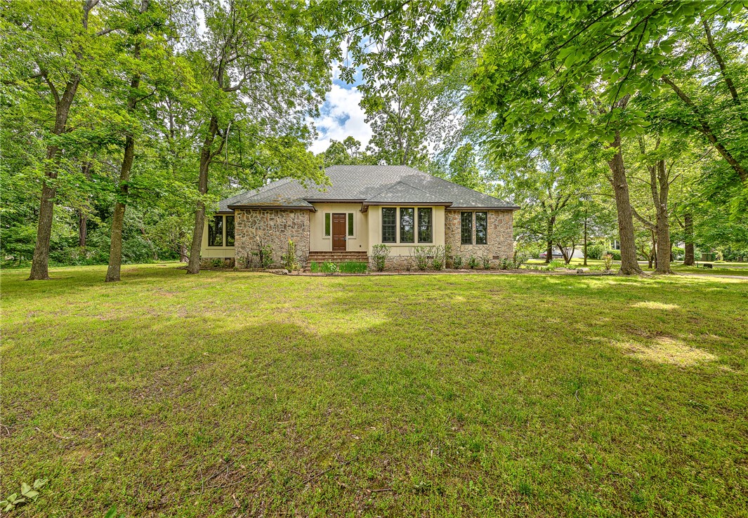 OPPORTUNITY AWAITS IN GREAT LOCATION! First time on market since custom-build in 1997. Located on 1.18 acre +/- partially wooded lot in the Montefiori subdivision, this 2-story 3,355 sq ft two bedroom, 3-bath house offers expansive open-floorplan living & includes oak floors, many custom built-in oak cabinets, bookshelves and counters; beautiful floor to ceiling windows along back of house overlooking wooded grounds and stone patio; large private second story primary suite and bath, with multiple closet and storage space and much more! Exterior is stone and stucco with brand new stucco(that also included new framing at back of house). Brand new roof(with assignable warranty) that included custom flashing and pans for drainage at new stucco patio walls. A touch of personalization and interior updating will unlock great potential and make this home shine in an extraordinarily private and quiet 7-home area that is centrally located and close to everything—shopping, dining and trails are just minutes away.