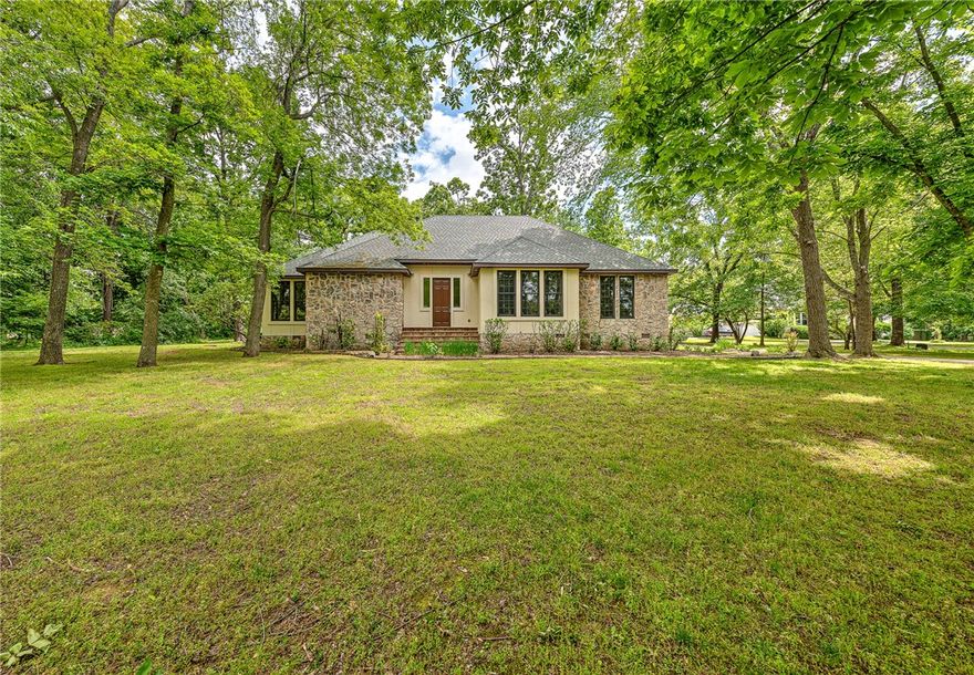 OPPORTUNITY AWAITS IN GREAT LOCATION! First time on market since custom-build in 1997. Located on 1.18 acre +/- partially wooded lot in the Montefiori subdivision, this 2-story 3,355 sq ft two bedroom, 3-bath house offers expansive open-floorplan living & includes oak floors, many custom built-in oak cabinets, bookshelves and counters; beautiful floor to ceiling windows along back of house overlooking wooded grounds and stone patio; large private second story primary suite and bath, with multiple closet and storage space and much more! Exterior is stone and stucco with brand new stucco(that also included new framing at back of house). Brand new roof(with assignable warranty) that included custom flashing and pans for drainage at new stucco patio walls. A touch of personalization and interior updating will unlock great potential and make this home shine in an extraordinarily private and quiet 7-home area that is centrally located and close to everything—shopping, dining and trails are just minutes away.