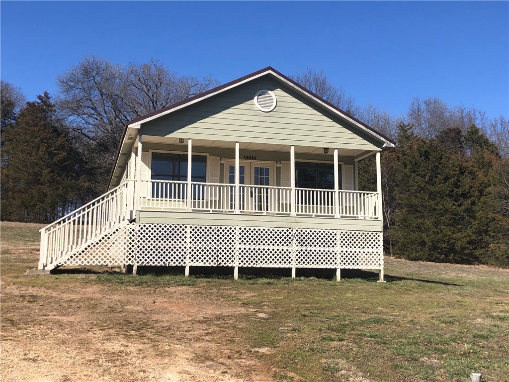 Own a piece of history in Northwest Arkansas!The Gayer Family Homestead in the community of Goshen has been in the Gayer family for over 100 years.Located just 7 miles from Fayetteville, the natural beauty of this property provides a perfect backdrop for outdoor adventures and family gatherings.Private 6 acres of rolling hills and pasture for horses, farming, gardening, riding/hiking trails.The 1144 SF home was built in 2005. It has an expansive covered porch, new metal roof, hardiboard siding and open concept LR/DR/Kit in the front to take in the view through multiple doors and windows. Utilities are electric, on-site septic & city water. A perfect AirBNB, your guests can enjoy the charm of the Goshen Farmers Market,Equine facilities, Dombeks Art Studios,& seasonal white bass fishing at the iconic Twin Bridges where the White River converges with Richland Creek. Zoned for Fayetteville Schools.