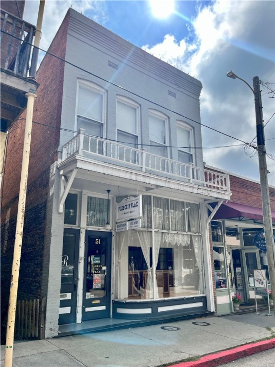 Locaation, Location!! This Spring St building offers a rare opportunity to own a property in the heart of the Eureka Springs historic shopping district. Each level offers independent access. The main level is a beautiful retail space with large windows and historic fixtures. The upper level is a 2 bedroom apartment perfect for an owner/operator or for use as nightly lodging. The lower level can be adapted to a variety of uses including retail, studio or additional apartment.