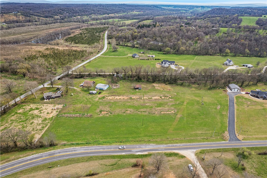 Beautiful property less than a 1/4 mile from Wedington Wildlife management area where you can enjoy hiking, mountain biking and lake Wedington! Property has been perc tested, electric on site and septic system design available. Property is flat and easy to maintain and has a creek that flows off of Lake Weddington flowing right through it! Investors looking to build this is a perfect spot to potentially build some homes! Schedule your showing today.
