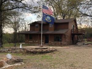 WOW...what a VIEW... and this home offers 4 bdr, 2 bth, 4 car garage, 17 beautiful mowed acres, fenced, storm shelter, 3 storage buildings, decks galore, dead end road, what more could you ask for? Call for your showing today.
