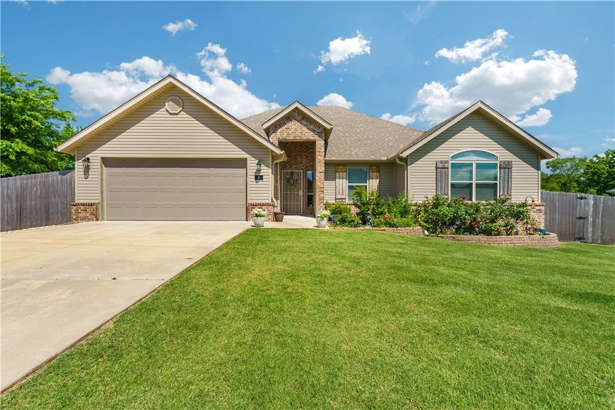 Welcome to 6 Briscoe Lane. This one has so much of what you are looking for but is so rare to find in Bella Vista. . . an oversized flat lot with a wood privacy fence, lawn, large covered patio deck and a workshop with electricity and AC! This almost new split floorplan home sits on 0.43 acres. The backyard is fully landscaped with a lawn, flower beds, rock border and privacy. The kitchen features granite counters, stainless steel appliances and a pantry. The open concept living space flows perfectly for entertaining and everyday living. Primary suite includes a tray ceiling, dual vanity, tiled shower, garden tub, heated toilet seat & walk-in closet. Wood appearance tile floors flow throughout the main living space. Laundry is off the primary suite. Workshop is insulated, permitted and has AC and electricity. Gutters on exterior of house. Conveniently located. . . only 1 mile to I-49, a 2-minute drive to Highlands Golf Course, a 5-minute drive to Branchwood Recreation Center & 20 minutes to the new Walmart HO.