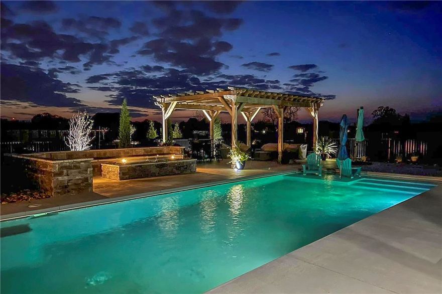 Your private backyard oasis awaits you! No need for a vacation. Contemporary 6 bedrooms, 4.5 baths, chef’s kitchen with professional series appliances. Media room with wet bar. Dog washing station in laundry room close to back door. Oversized 3 car garage, boat depth. Amazing primary bedroom with wood ceiling & a lady’s dream closet. Access to outdoor hot tub. 16X40 gunite , heated, saltwater pool.  16X20 cedar pergola with curtains, 96”resort style gas fire pit, stone bench seating with additional seating at south end of pool. Roll down sunshades across large patio. Outdoor kitchen with another fireplace. Professionally landscaped with irrigation system. Custom aluminum “wrought iron” fence around pool for safety and to keep pets out. One look and you’re SOLD!