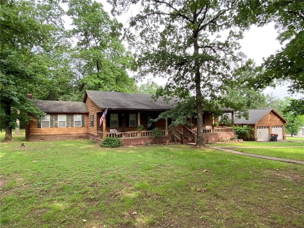 Charming county home with modern updates and a bonus room with wood stove. This beautiful home has three bedrooms and two full baths. Just at the bottom of Mount Nebo State Park. Contemporary open living space. Beautiful remodeled kitchen. Brand new HVAC. The property is 1.5 acres, perfect for relaxing, entertaining or gardening. Two car detached garage/work space. Move in ready, call to see it today.
