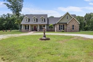 Privacy and seclusion but easily accessible to all of Northwest Arkansas! This 15 acre estate has been partially cleared but also has plenty of trailed wooded areas to explore. This beautiful farmhouse style home has engineered hardwood floors throughout. The stylish kitchen has tons of storage, granite countertops and stainless steel appliances. The primary suite is spacious and has a built in safe room! Outside, enjoy the expansive 40x60 detached shop with two bay doors, an overhang, and the potential to add a second living area—ideal for workshops, hobbies, or additional dwelling space. The property invites outdoor living with garden areas, walking and ATV trails, and endless opportunities to explore and relax. Don’t miss out on this incredible opportunity—schedule your tour today before it’s gone!