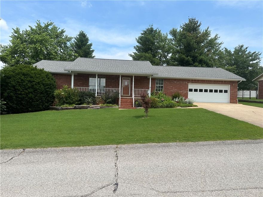 4BR 3BA Brick home with over 3,000 sq feet on corner lot in quiet neighborhood.  Large open floor plan, Gas fireplace, 12x14 sunroom plus large deck to enjoy.  2 car garage on the main level and large garage in the basement for a work shop or deep enough to hold a boat easily.  New roof recently installed, new H/C unit in the last few years.