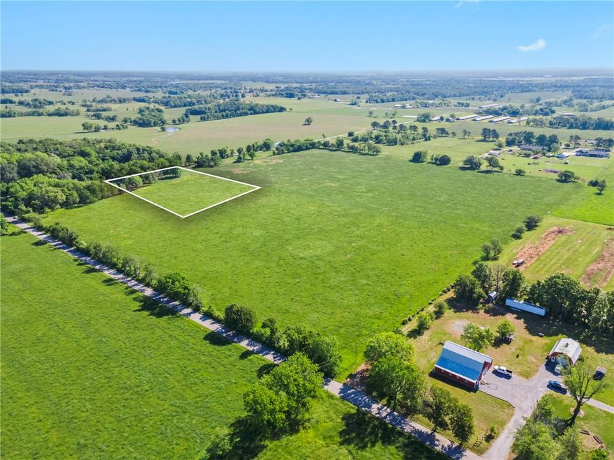 Just 10 minutes from the Northwest Arkansas airport, discover an exclusive opportunity to claim 3.77 acres of pristine, flat land where elegance and tranquility meet. This rare gem offers uninterrupted views of both sunrise and sunset, creating a breathtaking backdrop for a lifestyle of refined comfort and serenity. The land stretches wide and open beneath a vast sky, inviting you to dream without limits. Imagine a custom estate tucked into the peaceful landscape—grand entrances, sleek architecture, manicured grounds, and sophisticated outdoor spaces designed for hosting under the stars. Whether you’re envisioning a modern sanctuary or a timeless retreat, this land provides the foundation to build your legacy. Privacy, beauty, and convenience converge in one exceptional location—close to everything, yet far enough to feel like your own private escape. Your future deserves a setting this extraordinary. Let luxury begin here.