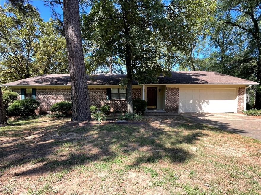 Welcome to this charming 3-bed, 2-bath home in desirable Sunset Hills at the foot of Hilltop. The inviting living room features a cozy wood-burning fireplace with blowers, perfect for cool evenings. A spacious layout offers large bedrooms with ceiling fans, neutral paint throughout, and an oversized laundry room with abundant cabinetry for storage. The kitchen includes a breakfast bar and opens to a separate dining room with French doors leading to a large covered deck—ideal for entertaining. The fenced backyard provides plenty of space for kids, pets, or gardening. Practical updates give peace of mind with a roof (2013), HVAC (2017), and water heater (2020). A two-car attached garage adds convenience and storage. This home combines comfort, functionality, and charm in a sought-after neighborhood—don’t miss your chance to make it yours!