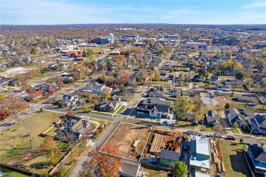 Amazing lot in Downtown Bentonville ready for development. A Developers Dream! Property has been rezoned to RN-2. Nestled in the vibrant heart of downtown Bentonville, this fully cleared corner lot offers an exceptional opportunity to build your dream home. Spanning .24 acres, this desirable parcel is just one block from the center of the action, surrounded by stunning multimillion-dollar homes. The property comes equipped with convenient onsite utilities, including sewer, water, and electricity, making it ready for your new build right away. This is a rare chance to secure a piece of prime real estate in a flourishing community. Imagine crafting your dream home, tailored to your unique vision and lifestyle, in partnership with an award-winning builder known for excellence and innovation.