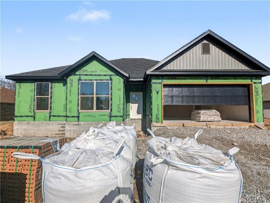 Welcome To Your Next Home! This One Is Just Getting Started And Checks Every Box. It Will Be A Beautiful New Build With Style, Function, And That “Feels Like Home” Energy From The Moment You Walk In. The Vaulted Living Room With Beam Accents Adds Warmth And Character, Flowing Seamlessly Into An Open Kitchen With A Large Island, Quartz Counters, Custom Cabinets, And Great Natural Light. The Split Floor Plan Keeps The Primary Suite Private With A Spacious Bath And Walk-In Closet, While The Additional Rooms Offer Flexibility For Guests, Work, Or Play. Step Outside To A Covered Back Deck Overlooking A Super Flat Backyard, A Rare Find In Bella Vista! Perfect Spot For Kids, Pets, Or Your Future Firepit. Convenient Location With Easy Access To I-49, Shopping, And Dining While Still Offering The Peaceful Setting You’ve Been Looking For. Contract Early To Make Selections. Deeded As 2 Bed Septic. 3rd Room To Be Considered Office/Bonus Or Other Non Sleeping Room. Signed Acknowledgment Of Such Required.