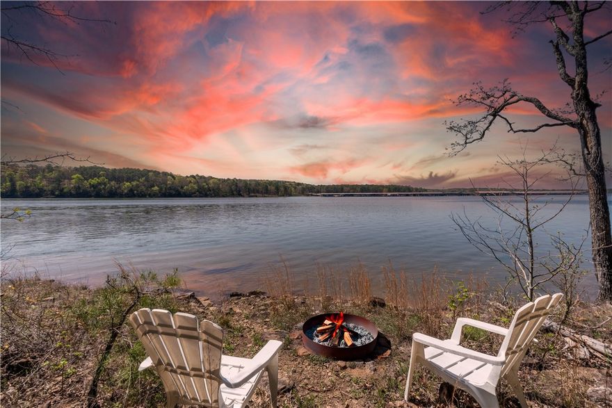 Welcome to your dream lakefront home at a peaceful cul-de-sac, offering privacy and access to Greers Ferry Lake. The main home includes 2 spacious bedrooms, 2.5 baths, an open-concept design, and a covered deck for sunset views. A charming 2-bedroom guest house and a dedicated office in the garage provide extra space. With 120 feet of shoreline for swimming and boating, the property features dramatic cliffs and accessible shoreline. Located near Dam Site Marina, this lakeside retreat is perfect for both full-time living and weekend getaways, offering stunning views and flexible living spaces.