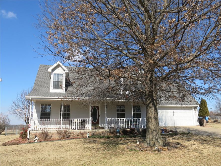 Immaculate country home at west edge of Springdale nested on 1.62 acres. Tastefully decorated with wood flooring, granite kitchen countertops, and eat on bar. Master bedroom on main floor, cozy fireplace with insert and country front porch. Large lot with 2 storage buildings, covered parking for an RV, newer storm shelter, and great garden area!