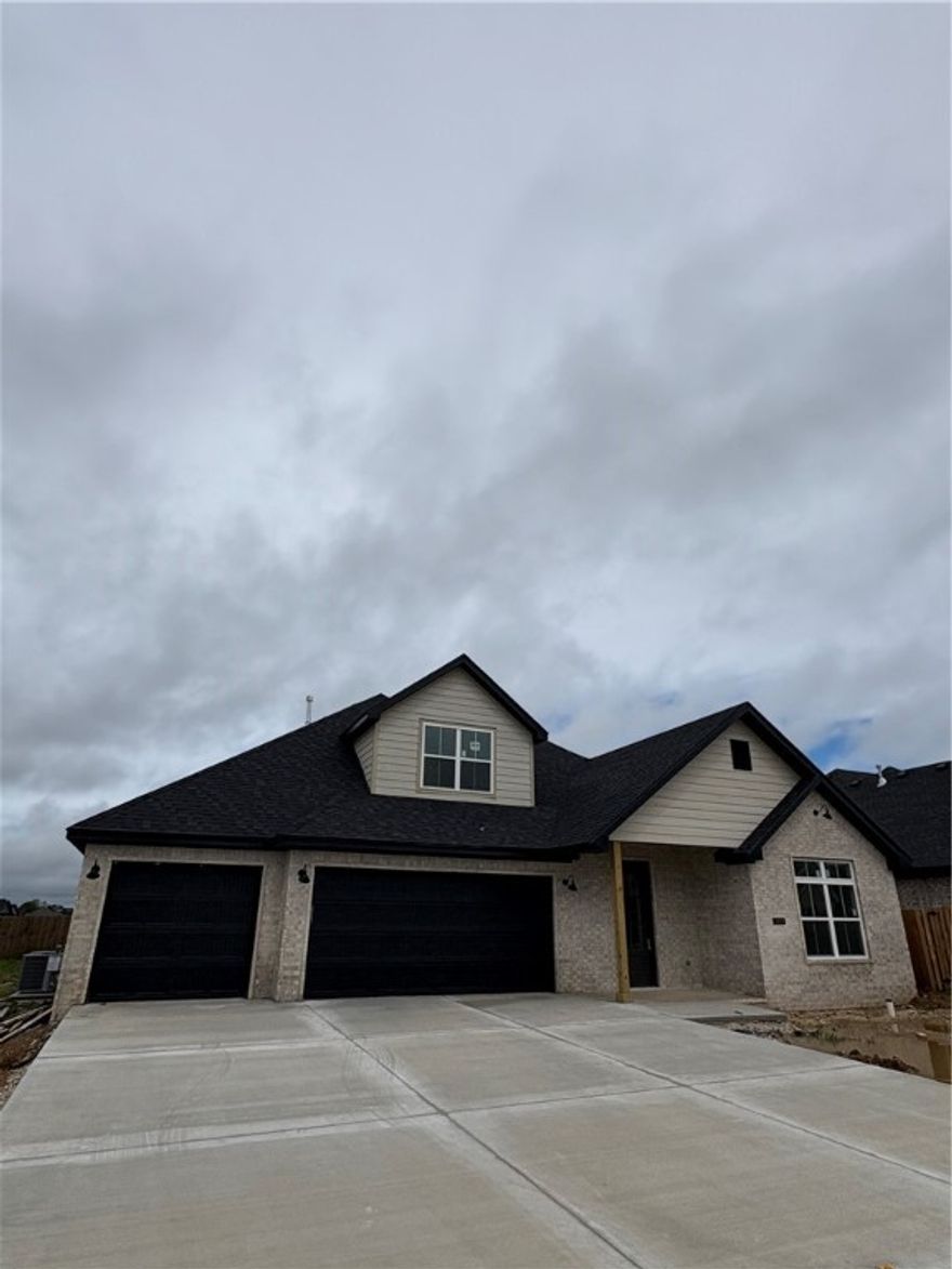 This two-story home invites you in with an open floor plan, vaulted ceilings, and a customized fireplace in the family room. Another room just off entry could be used as a 5th bedroom/flex or office space plus four other spacious bedrooms, three full bathrooms, and generous utility room, laundry, pantry, closets, and a three-car garage. Designer-chosen finishes and details; paint colors, countertops, tile, engineered wood flooring, accent walls, and lighting. It comes with fence, gutters and blinds. The community has a nice pavilion, pool and playground. Situated minutes from I-49, Golf Courses, Winery, Arvest Ballpark, Arkansas Children's Hospital and good restaurants! Lender credits of $5000.00 with preferred lender.  Home is estimated to be completed by July 4th. Schedule your tour today!!