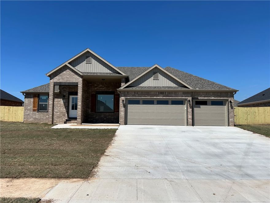 Stunning new construction—this single-story home features 3 bedrooms, 2 bathrooms, and a spacious 3 car garage. The kitchen is equipped with stainless steel appliances, a gas range, microwave vent hood, pantry, and granite countertops. A large fireplace flanked with built-in bookshelves serves as a striking centerpiece in the living room. Elegant details include wood-cased windows with 2-inch blinds throughout. Enjoy great curb appeal with a large front porch, fully sodded oversized yard, and a privacy fence. The covered back porch and fully installed gutters add both comfort and functionality. The primary suite boasts an oversized tiled shower and a walk-in closet that connects directly to the laundry room, located near the garage for added convenience. Durable brick exterior construction ensures longevity and low maintenance. Interior photos are of similar plan, interior finishes may vary.  Seller will pay $2,500 in buyer concessions.  $5,000 credit available with preferred lender.