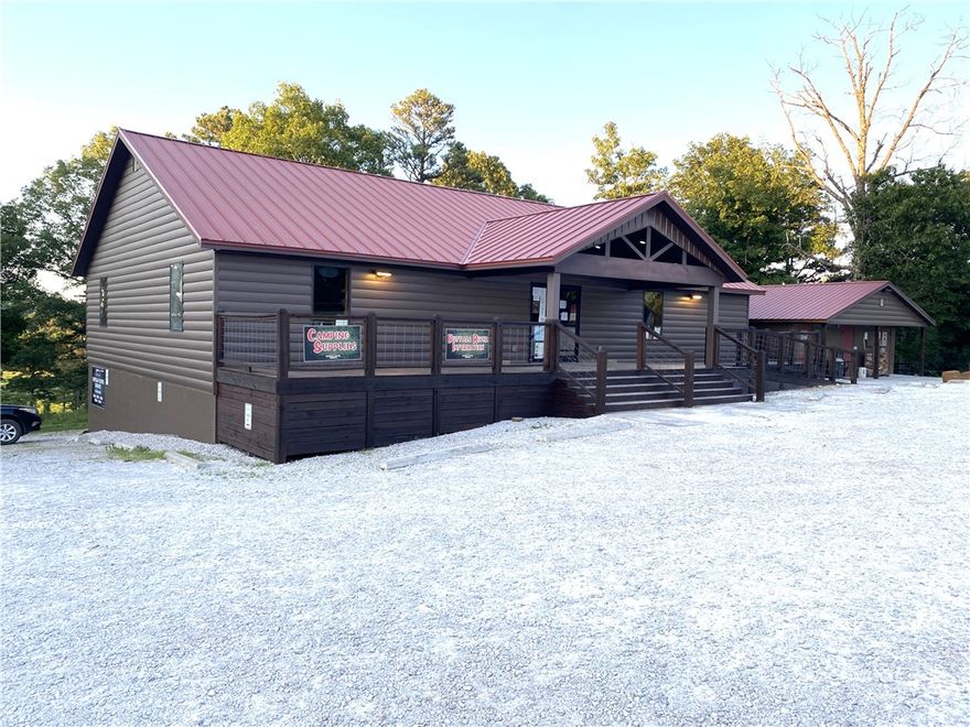 Strategically located at the junction of Hwy 74 & Kyles Landing Rd (5 mi from Jasper) near Kyles Landing Access Point/Campground (2.6 mi) & Triple Falls Waterfall of the Buffalo National River. High traffic count location. Located between Jasper and Ponca and near the Ozark National Forest. Located on 2 ac. The main bldg features 1600SF retail space, 800SF offices/restrooms, 2400SF unfinished basement (with 400SF finished living quarters),1200 SF of decks/porch, 400 amp underground service to the building, Two-5 ton and One-3 ton HVAC, Two-1000 gal septic tanks w/600' of lateral lines. Property includes Bathroom/Coin operated shower house (24 hr access), 1800SF Maint Shop and Koolaire 300 lb ice maker. Business property  aluminum Elk Statue and retail inventory. This listing does not include the canoe rental and inventory associated with the canoe rental (canoes, rafts, kayaks, paddles, life vest, vehicles, trailers). The canoe rental (with the real property in this listing) is listed as MLS#1312587.
