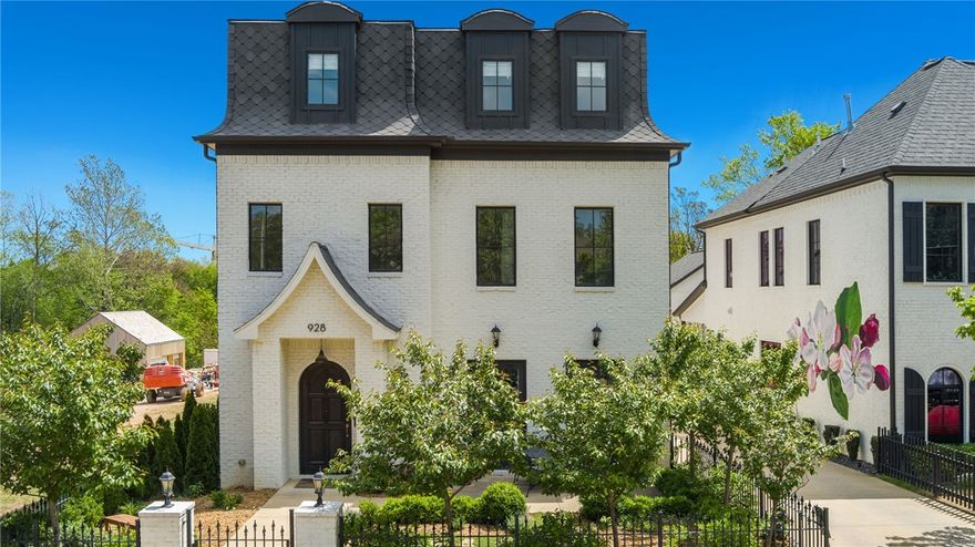 Modern and elegant living awaits in this 3-level European inspired home. A lovely courtyard with an iron gate leads to the stunning front door. Discover a bright and open-concept design on the first level boasting a living area that seamlessly flows to the kitchen, and a bonus space for a playroom or office. The kitchen features quartz counters, an oversized island, and access to the covered back patio. Continuing to the 2nd level is the primary suite, 2 bedrooms with a jack-and-jill bathroom, and a utility space. The primary suite is equipped with modern fixtures, a large walk-in shower, and a soaking tub. The third level is complete with an expansive flex room with an additional bedroom and bathroom. Exquisite details in the home include the fireplace, beautiful french doors in the living room, and built-in storage throughout. Additionally, above the large detached garage with ample storage is a separate studio apartment. Experience Downtown Bentonville living close to Crystal Bridges Museum, trails, and more.