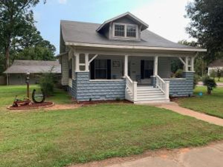 Historic Home on 5 City Lots with Shop/Covered RV parking.in the back along with a 2 car detached garage.  New Roof on house in 2014.New roof on Garage and Shop in 2017.New H&A unit for lower level of house in 2018. New Alarm system in 2019.New Front Porch in 2019.Did I mention the 4 Large Pecan Trees on the property!!!