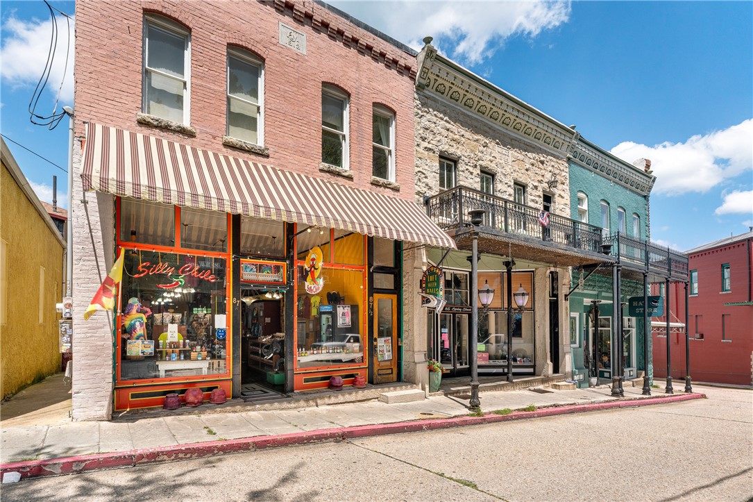 Prime location on iconic Spring Street in historic downtown Eureka Springs! This unique building offers endless possibilities with a retail storefront on the main level and a charming 2-bedroom space upstairsācurrently a successful Airbnb generating approximately $40K annually and offered fully furnished with an acceptable offer. Just steps from shops, dining, and local attractions, this property offers excellent foot traffic and significant income potentialāranging from approximately $30,000 annually if the retail space is rented, up to $400,000+ if owner-operated. A dedicated parking space is included, and the basement (about 600 sq ft) offers exciting potential to be finished for additional income or converted into a private apartmentāallowing the owner to live on-site while retaining both retail and Airbnb spaces. This is a rare opportunity to own an entire building in one of Arkansasā most beloved destinations, surrounded by a quaint streetscape, rich history, and vibrant culture.