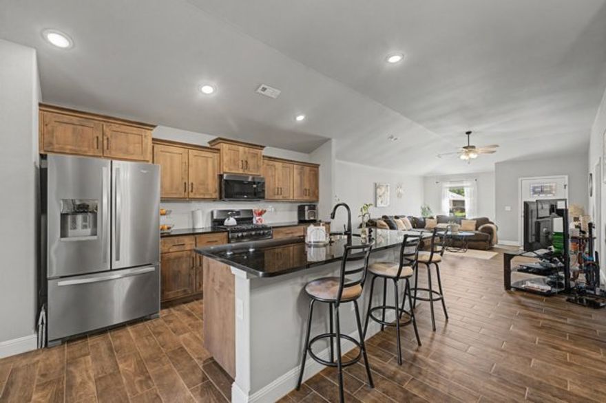 $3,150 towards Buyer's Closing Costs PAID by using seller's preferred lender! Just 2.5 miles from NWA National Airport, this home has privacy and seclusion but just minutes from everything Benton County has to offer. Only 3 years old with beautiful wood tile flooring throughout, carpet in bedrooms. The open floor plan is great for entertaining with an eat-in kitchen space, beautiful granite countertops and island, along with gas stove, pantry, and tons of cabinet space. Walk in laundry room, split floor plan and quaint backyard setting. This community has a large dog park. Come and see this clean, spacious, well maintained, like new home! Visit ardot.gov for details regarding the future North/South 4 lane road plan for this area, bringing access to amenities right near you! With confirmed plans by the end of this year, and completion in 5, now is the time to buy in one of the lowest priced new construction areas in Benton County.