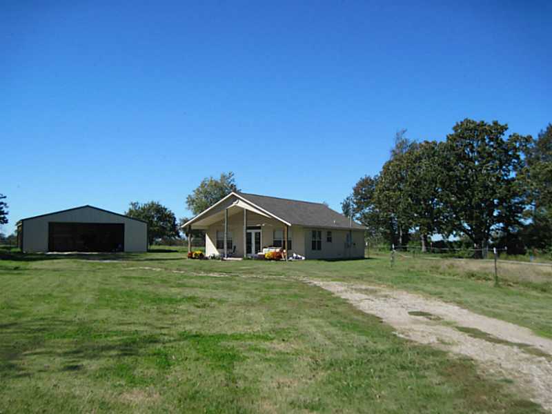 2008 two bedroom 2 bath/jacuzzi home with newer metal pole barn on peaceful two acres in the country. Rural water nice setting! Good Condition!