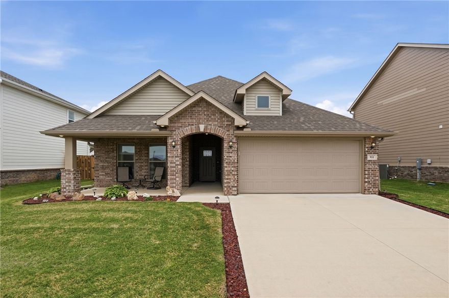 Located only 1 mile from top-rated Bentonville schools, this 3 year-old, 3 bedroom & 2 bath home has been well-kept is truly move-in ready. The full brick exterior makes a great first impression, while the upgraded LVP flooring throughout provides easy maintenance and a clean, cohesive feel. The eat-in kitchen features a walk-in pantry, ample cabinet space, and a peninsula with seating, ideal for casual meals or gathering while you cook. The primary suite offers dual vanities, a walk-in tile shower and soaking tub, everything needed to unwind at the end of the day. A generous-sized laundry room with added shelving is centrally located, connecting directly to the large primary closet as well as the kitchen for everyday convenience. Out back, a fully fenced yard with gates on both sides of the home offers privacy, a space to play, grow a garden, or make into your own retreat. Quick access to highway 49 this home provides the perfect blend of style, comfort and convenience to all your essential needs.