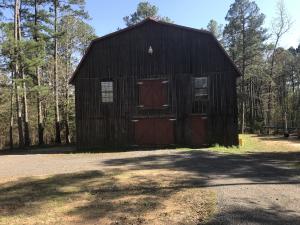 BEAUTIFUL CUSTOM BUILT CABIN, METAL ROOF, CEDAR WALLS UPSTAIRS, NEW CABINETS WITH GRANITE COUNTERTOPS & COMMERCIAL GAS COOK STOVE IN KITCHEN, HIGH CEILINGS, BUILT-INS, HARDWOOD FLOORING, ALL ON 9.23 ML PRIVATE ACRES WITH A LARGE DECK OVER LOOKING THE POND AND A CIRCLE DRIVE.