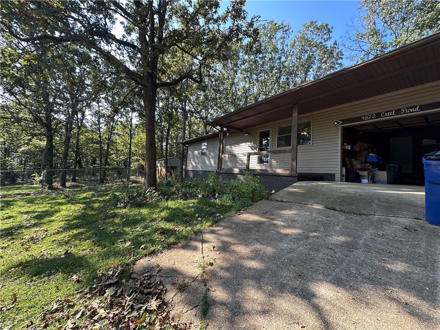 Nestled on 1.34 peaceful acres along a paved road, this inviting 3-bedroom, 1-bath home offers the perfect balance of comfort and convenience Located just minutes from Harrison and a short drive to Ponca and the Buffalo National River, it’s an ideal spot for anyone who enjoys both small-town living and outdoor adventure. The home has been tastefully updated and is move-in ready, featuring warm, welcoming spaces throughout. Outside, you’ll love the private backyard retreat with mature shade trees, a fire pit area for evening gatherings, and a separate fenced section—great for pets, a play area, or a garden. A charming country feel with easy access to everything you need!