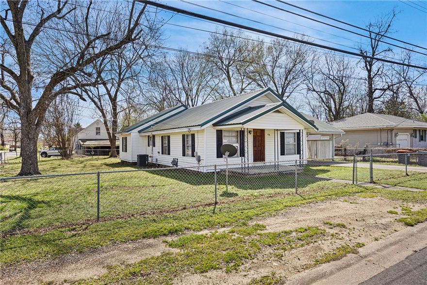 Charming single-story home in an established Russellville neighborhood featuring a spacious living area with updated paint and abundant natural light. The functional layout offers comfortable everyday living with plenty of potential to make it your own.
Exterior highlights include a durable metal roof, covered carport, and a fully fenced yard—ideal for pets or outdoor enjoyment. Mature trees provide shade and enhance the home’s curb appeal.
Conveniently located near schools, shopping, and local amenities, this property is a great opportunity for first-time buyers, downsizers, or investors.