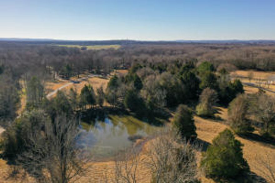 Welcome home. If you've been looking for the perfect place with privacy and seclusion but don't want to give up being close to amenities, this is the place you have been waiting on. Located 1.3 miles east of East German Lane on Lower Ridge Road, less than 15 minutes to 2 major hospitals and 2.7 miles from the heart of Conway. This 4100sf custom built main home features 5 bedrooms, 4 baths, large office, 2 car attached garage, underground storm shelter and sits on a gorgeous 32+/- acres. The large open family room flows into the kitchen/dining area with plenty of cabinet and counter space and the home office is located at the front of the home with large windows that provide abundant light. There is also a separate 1156sf in law quarters behind the main home.