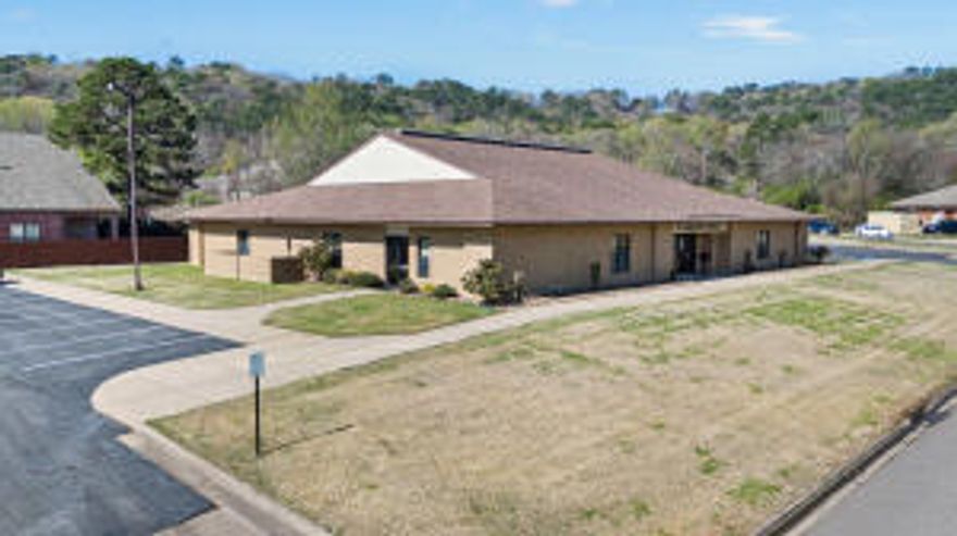 A great office building located in the medical district of Russellville.  Building would ideally cater to the needs of medical professionals and patients alike. Building is 9,104 square feet,  34 parking spaces with 18 on one side and 16 on other.  This building could be partitioned and made into multiple offices.