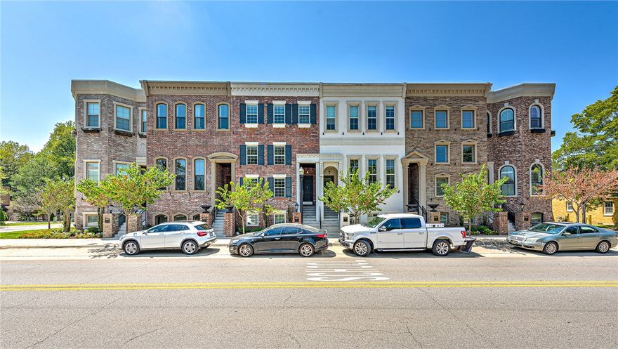 DOWNTOWN BENTONVILLE BROWNSTONE BEAUTY!! This gorgeous luxury townhome is just steps from all that downtown living has to offer including coffee shops, fine dining, trails, farmer’s market, First Friday and more! The 3 level Greenwich plan offers soaring 18 ft ceilings in the open living area that leads to a fabulous chef’s kitchen w/ sleek quartz counter tops and stainless appliances including a Wolf gas range! The primary suite boasts 10 ft ceilings and a luxurious en suite bath with oversized walk-in tiled shower! The second level hosts 2 guest bedrooms and a full bath plus an oversized veranda with picturesque views of downtown! Basement level features a spacious bedroom/bonus room with full bath and a laundry room! Second level also features a laundry room that could convert to a wet bar! 2 car garage! Enjoy the BEST in DOWNTOWN LIVING!