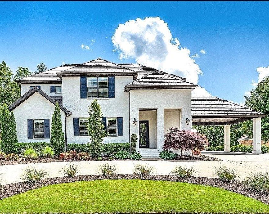 Classic elegance with modern style- a true stunner awaits you at 32 Wimbledon Way! New flooring, lighting & paint make this 4 bed/4.5 bath home better than new! Amazing laundry & craft room. Master with 2 closets & morning bar. Bonus upstairs w/2 bedrooms, bunk loft, walk in closets & en-suite full bathrooms. Private heated pool, pool house/or 4th bedroom, huge attic, screened in loggia & 4 car garage, 8 person tornado shelter are just a few of the extras!