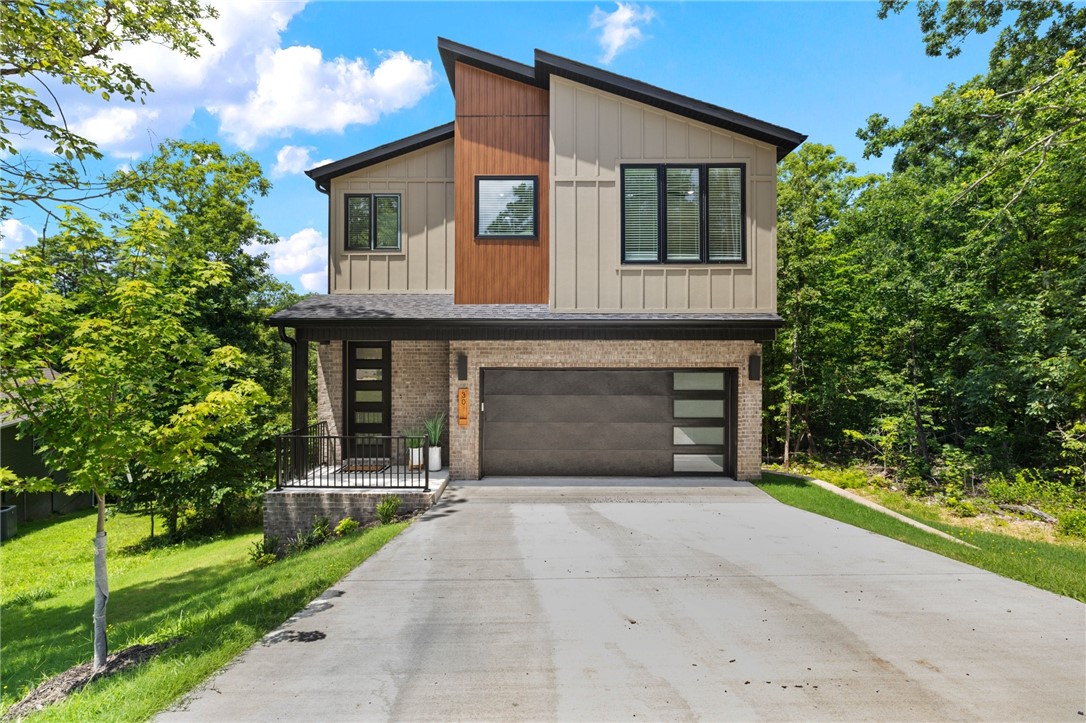 Modern Vibes in the Heart of Bella Vista with The "Back Forty" MTB system running behind the property and only 1.3 miles to Tanyard Creek.
A brand new, contemporary home that blends clean design with comfort and functionality. Surrounded by mature trees and tucked into a quiet street, this home offers the perfect balance of privacy and style.
Step inside to a bright and open layout with sleek finishes and an airy feel throughout. The main level is designed for entertaining, while all four spacious bedrooms are upstairs, keeping your personal spaces tucked away.
Enjoy coffee or unwind at the end of the day on the back deck with with wooded views ā no neighbors behind you, just trees and tranquility.
Convenient location for trails, lakes, and everything Bella Vista has to offer, this home is ideal for those who want modern design with access to outdoor living.
Low maintenance and move in ready. Comes with a standard builder one year warranty.
The garage is scheduled to get epoxy floors.