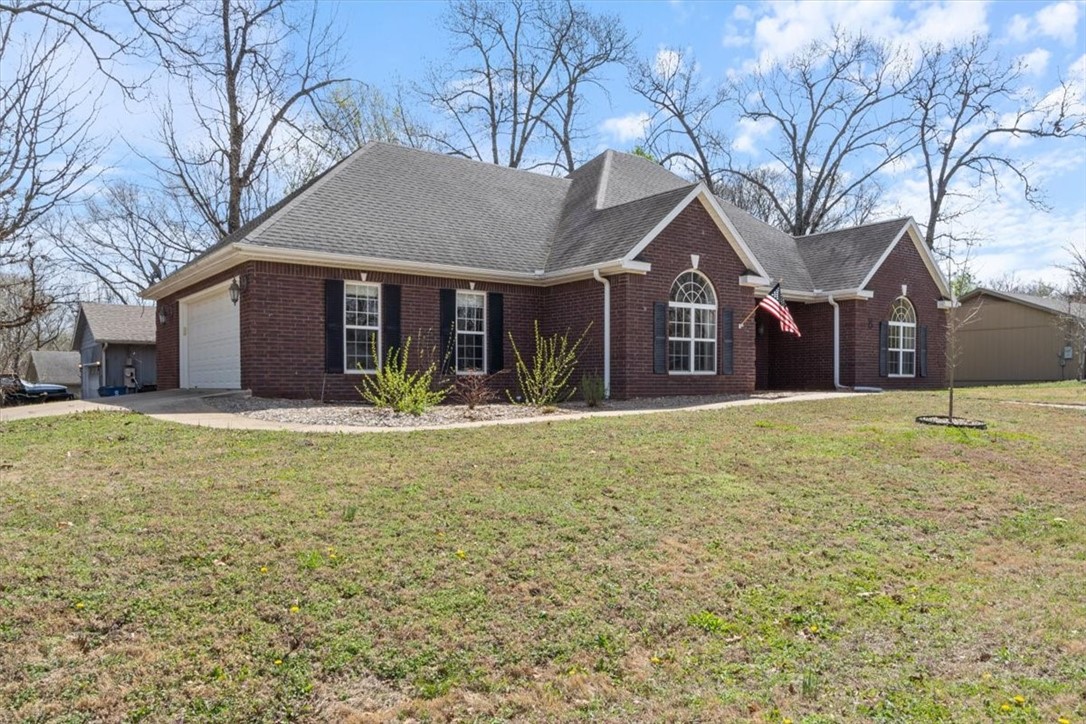 Bring your bike and your kayak! Half mile to trail access and 1 1/2 miles to Lake Avalon access! Three miles from Highway 71 with quick access to all points south! It's not often you'll find a fully bricked home or a side load garage, situated on a corner lot, so let's start with the beautiful curb appeal and no maintenance exterior. Once inside, you are welcomed into you open living/dining area with stunning new wood flooring. Off the living area is the perfect home office space, with new carpeting and vaulted ceiling. The kitchen has been updated with solid surface counters, new flooring, a new stove top and range hood. An abundance of cabinets and counter space! The primary bedroom features new carpeting, tray ceiling and a private bath with double vanity, whirlpool tub and walk in shower. The additional bedroom is ready for your guests with new carpet! Enjoy your coffee in your sunroom and bring your puppy, who will enjoy the fenced yard! HVAC replaced 2023! Roof replaced with acceptable offer!