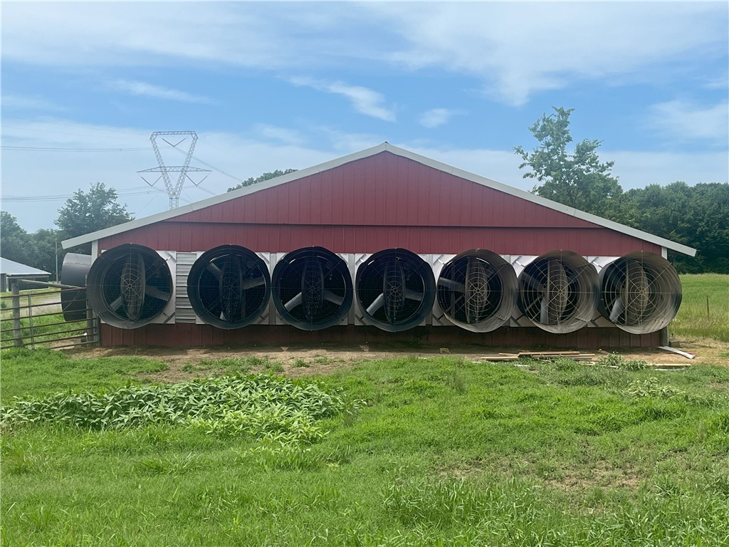 ALL NEW FANS, 32 new fans have been installed, and farm is also approved for 2 new roll seal doors, and heaters, all through NRCS and these practices are transferable.
The farm has 24 +/- acres, divided into two parcels, with four 40x400 Tyson broiler houses. Hay is currently being cut on the property, which is also suitable for pasture. The feed bins are in excellent condition with no leaks or rust. Insulation was added to the attics two years ago, and the south side walls have been enclosed. There are new tunnel curtains, an 18,000-gallon bulk propane tank, and two backup generators. Additionally, there is a 40x70 stacking shed. Two of the houses were constructed in 1986 and 1987, and the other two in 1993 and 1994. All houses are well-maintained.
Agents, please see remarks for further details.